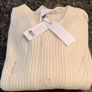 Helmet Lang Cream color sweater.